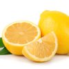 Lemon with leaves on white
