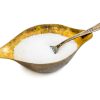 sugar in a metal sugar bowl isolated on a white background